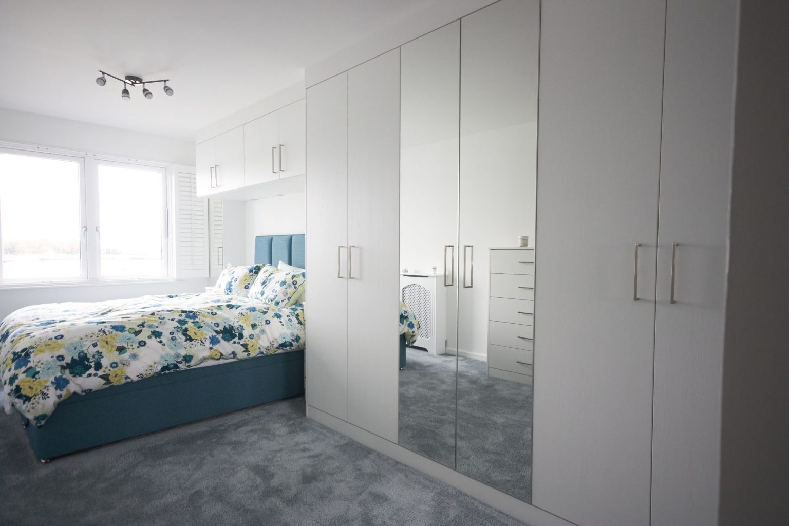 Timeless master bedroom with fitted storage